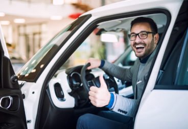 happy-satisfied-customer-just-bought-brand-new-car-vehicle-dealership